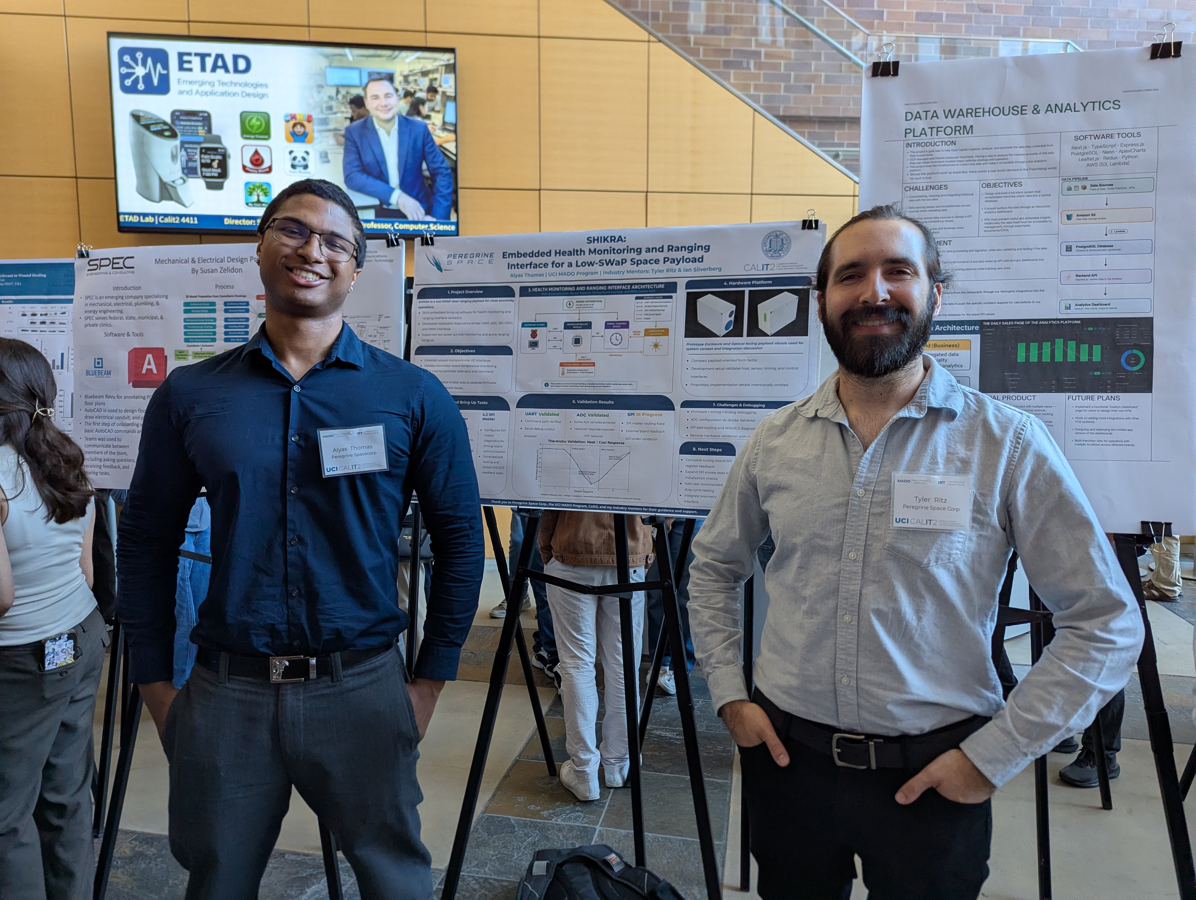 Alyas (left) and Tyler (right) at the MADO Poster Presentation